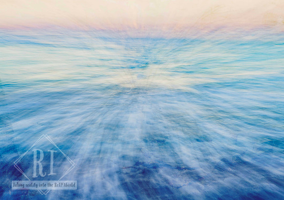 Abstract ocean-inspired photomedia artwork featuring soft blue and white motion blur radiating across the water toward a pale peach horizon. The image evokes movement, freedom, calm energy, and expans