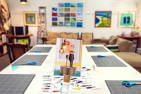 Creative workshop tables prepared for participants.