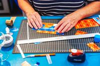 Participant creating handmade gift tags during a paper craft workshop at The Papery in Port Macquarie.