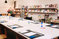 Workshop tables ready for participants at The Papery.