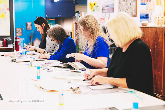 Participants enjoying a beginner surrealist collage workshop.