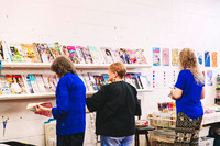 Creative workshop participants making collage artworks.