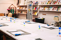Tables ready for a beginner collage workshop.