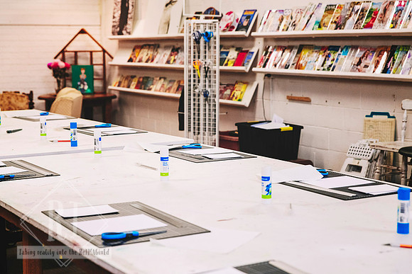 Tables ready for a beginner collage workshop.
