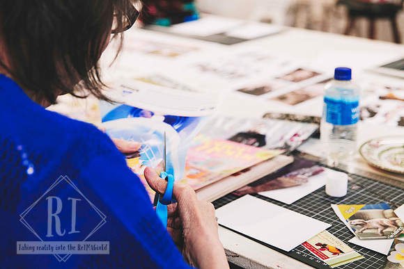 Participant arranging images for a surrealist collage project.