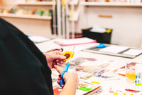 Collage making in progress during a creative workshop.