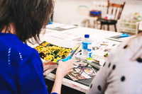 Creative paper collage workshop in progress.