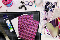 Journal covers and creative materials ready for a paper craft workshop.  Image 4