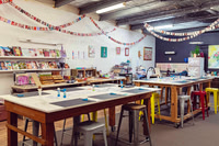 Workshop tables prepared inside The Papery studio.