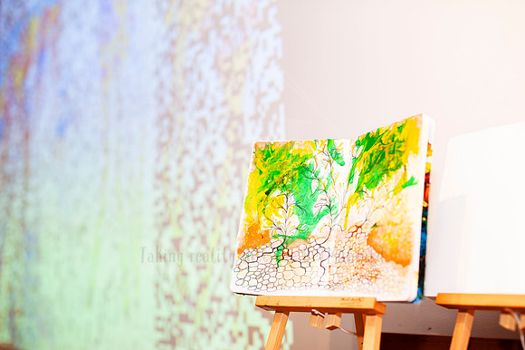 olourful mixed media painting on easel in gallery space, part of Port Macquarie creative content storytelling.