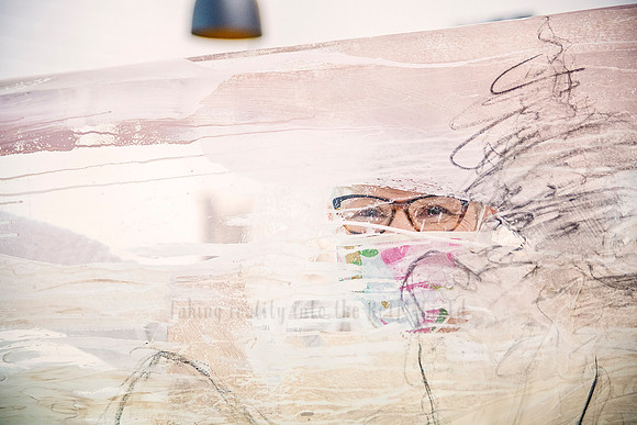 Close-up of abstract canvas showing expressive linework, facial detail, and Yvonne's signature style.